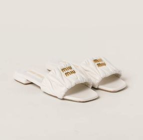 Matelassé nappa leather slides